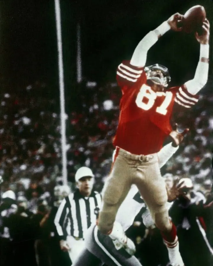 Dwight Clark leaping for The Catch
