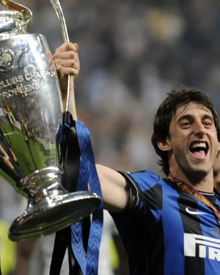 Diego Milito celebrating with the Champions League trophy